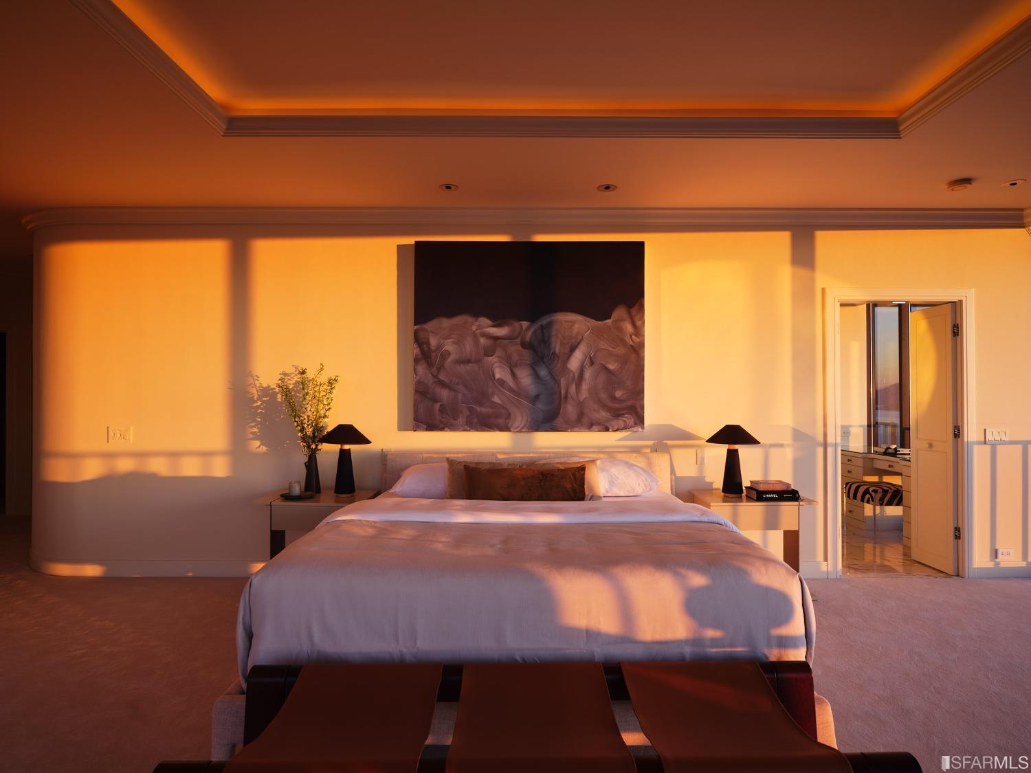 999 Green Street, Unit 3201 San Francisco, CA 94133 - Photo 21 of 28 a large bed sitting in a bedroom next to a window