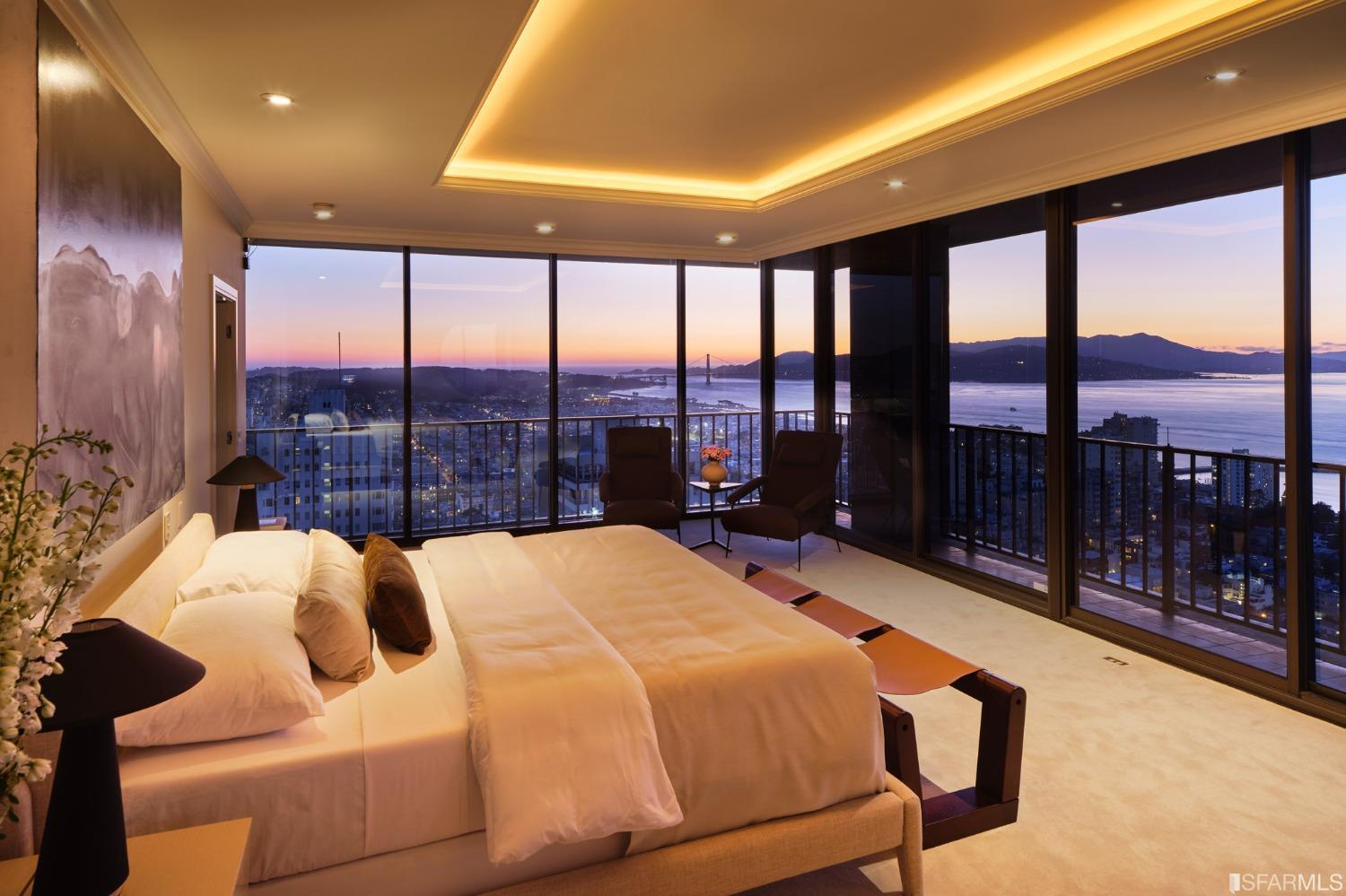 999 Green Street, Unit 3201 San Francisco, CA 94133 - Photo 22 of 28 a bed sitting in a spacious bedroom next to a large window