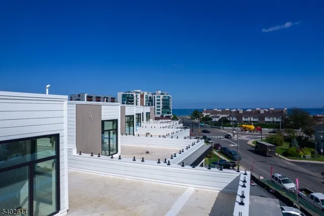 a view of a patio with a table and chairs