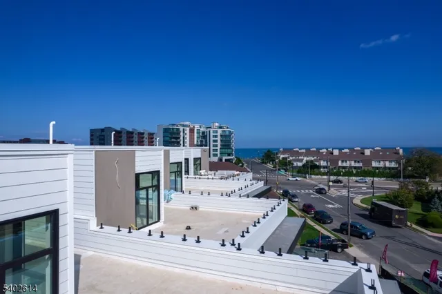a balcony with table and chairs
