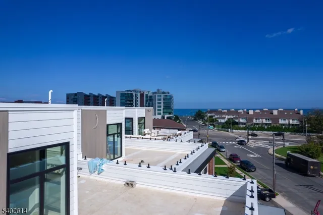 a front view of a house with outdoor seating