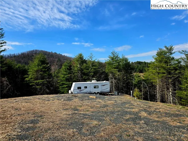 a view of a fountain in front of a lake