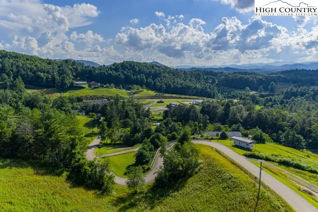 a view of a lake with a yard