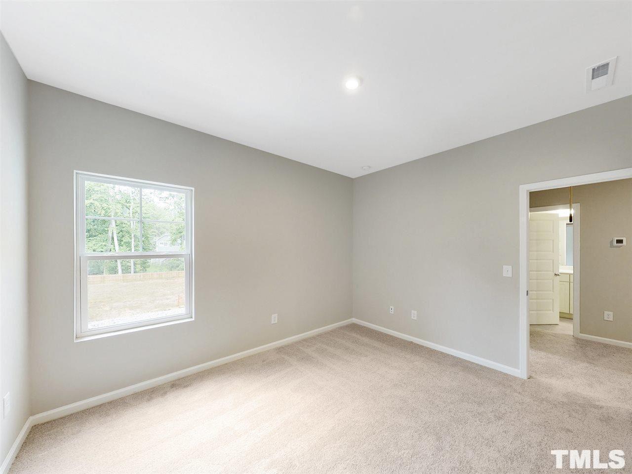 1605 Brussels Drive Apex, NC 27502 - Photo 11 of 17 an empty room with a window