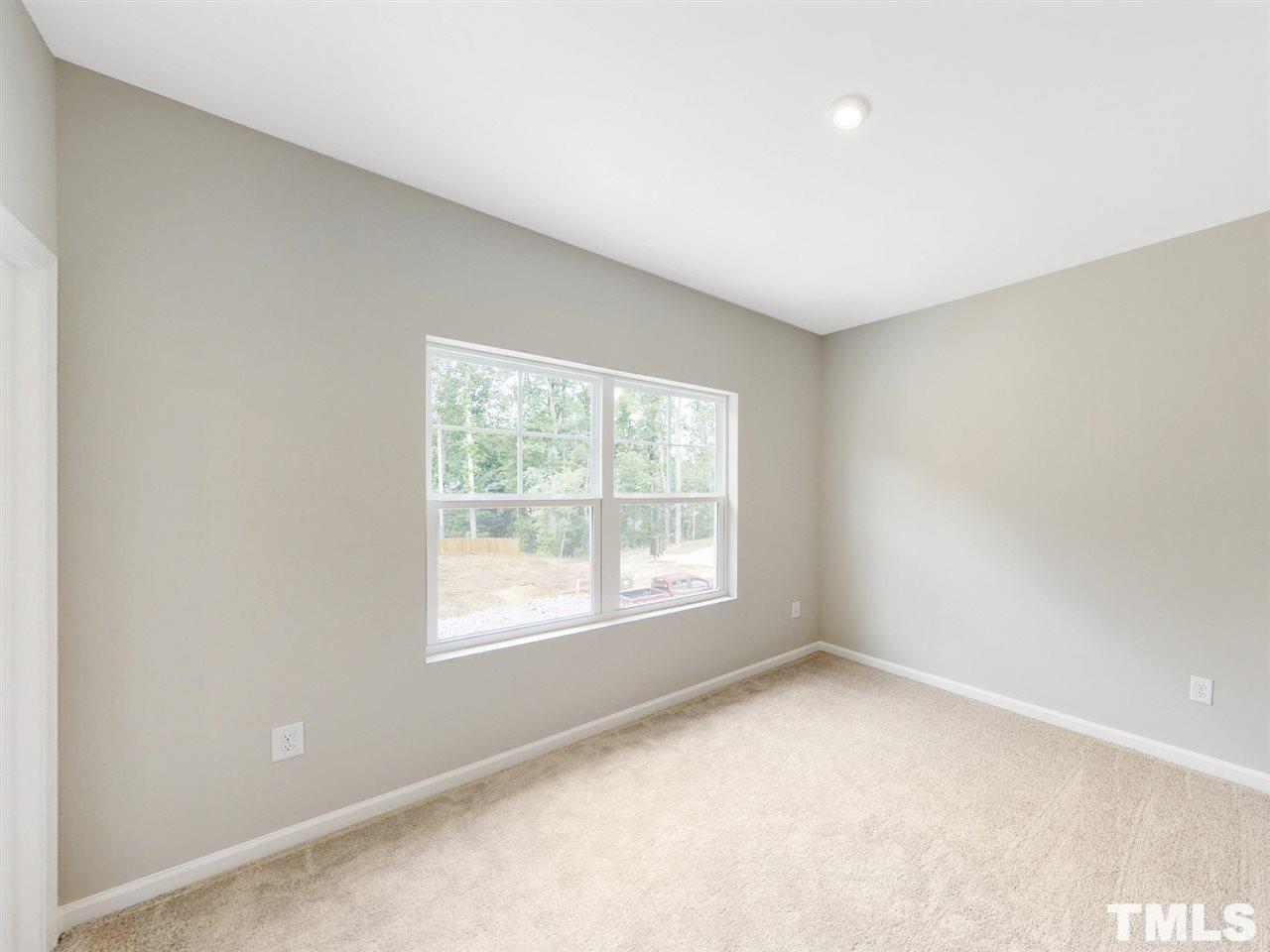1605 Brussels Drive Apex, NC 27502 - Photo 13 of 17 an empty room with a window