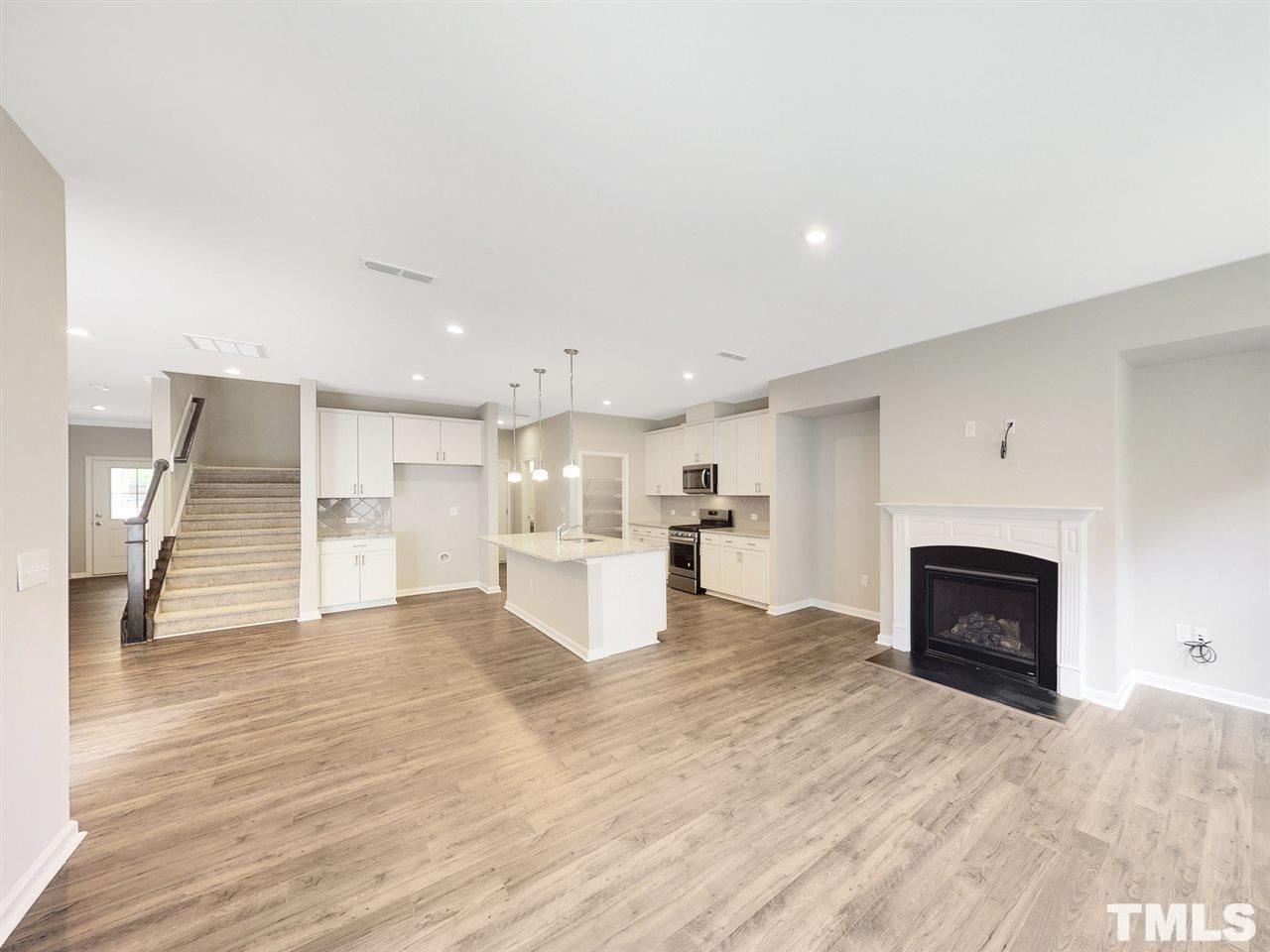 1605 Brussels Drive Apex, NC 27502 - Photo 2 of 17 a view of kitchen with furniture and a fireplace