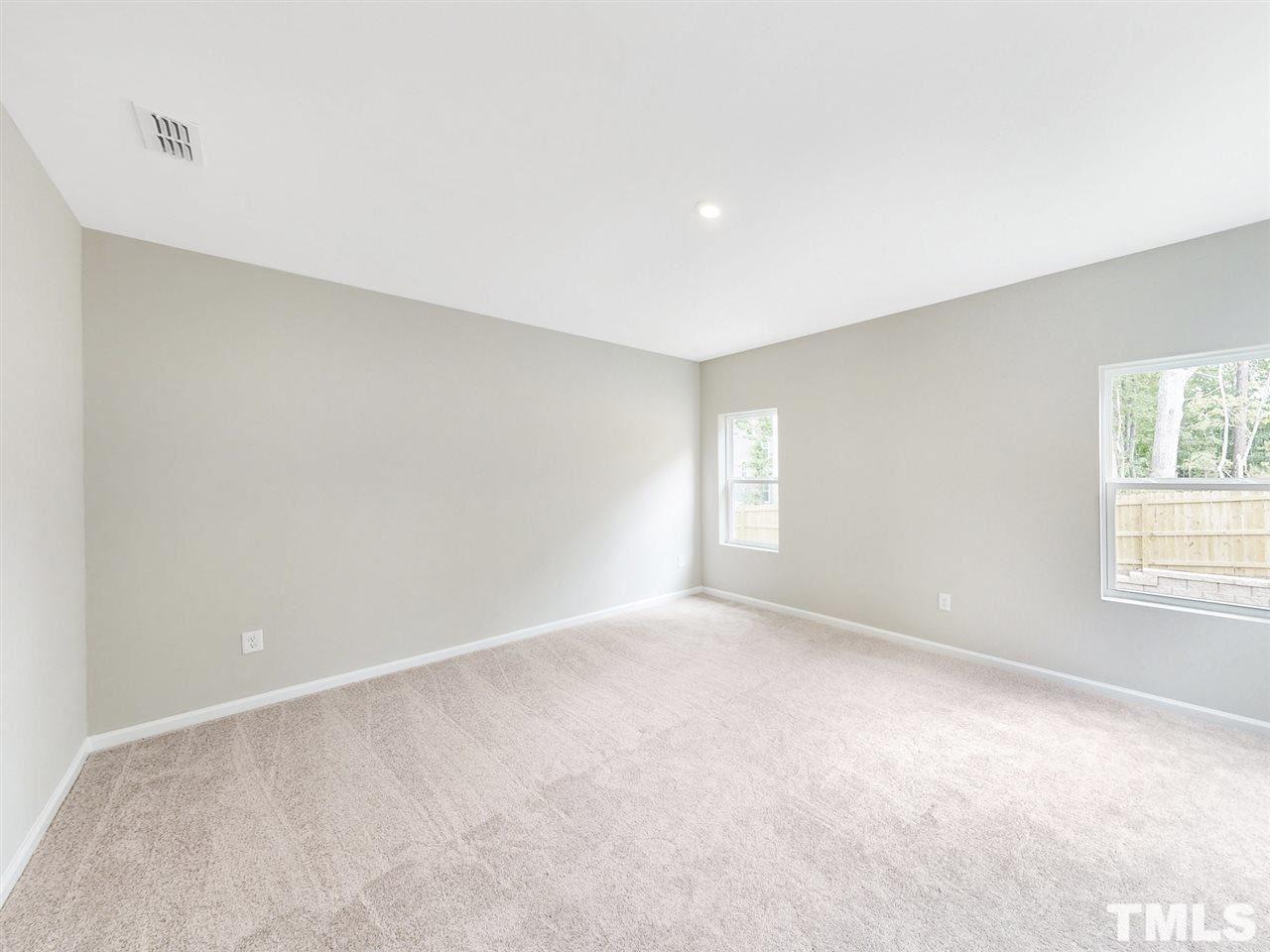 1605 Brussels Drive Apex, NC 27502 - Photo 6 of 17 a view of an empty room with a window