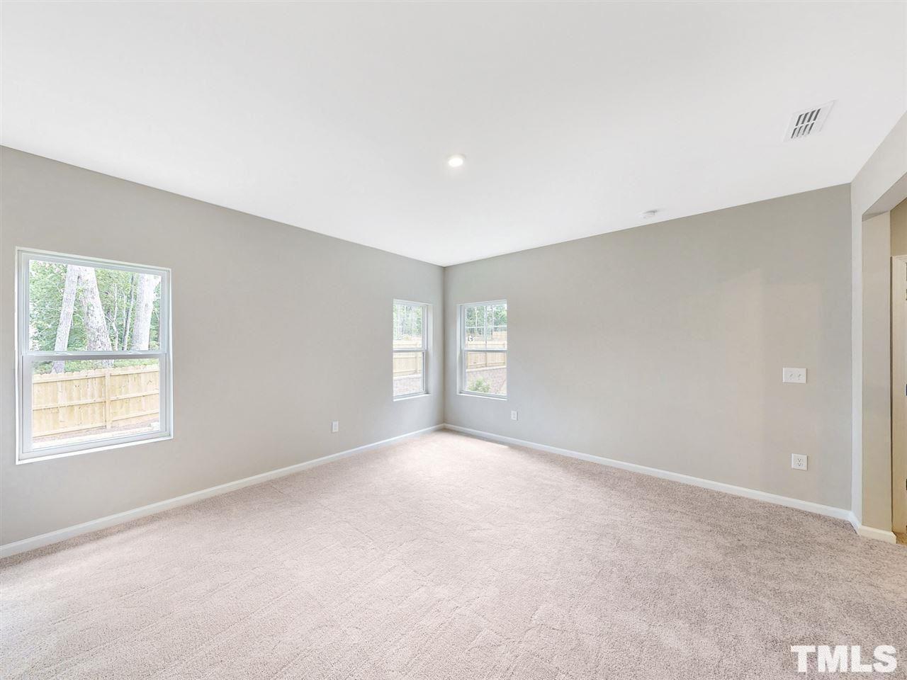 1605 Brussels Drive Apex, NC 27502 - Photo 7 of 17 a view of an empty room with a window