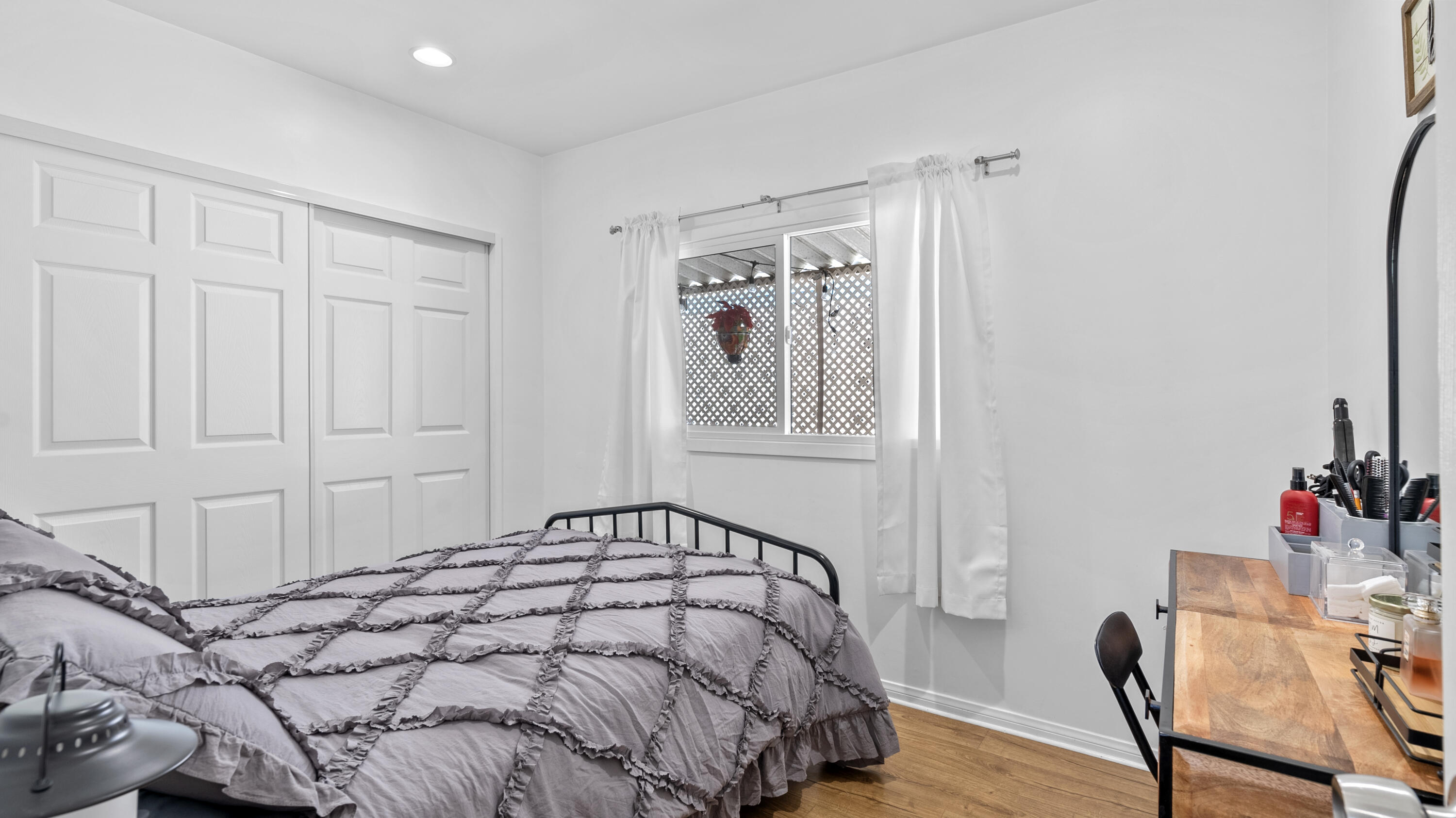 18035 Soledad Canyon Road Santa Clarita, CA 91387 - Photo 12 of 20 a bedroom with a bed and a table in it