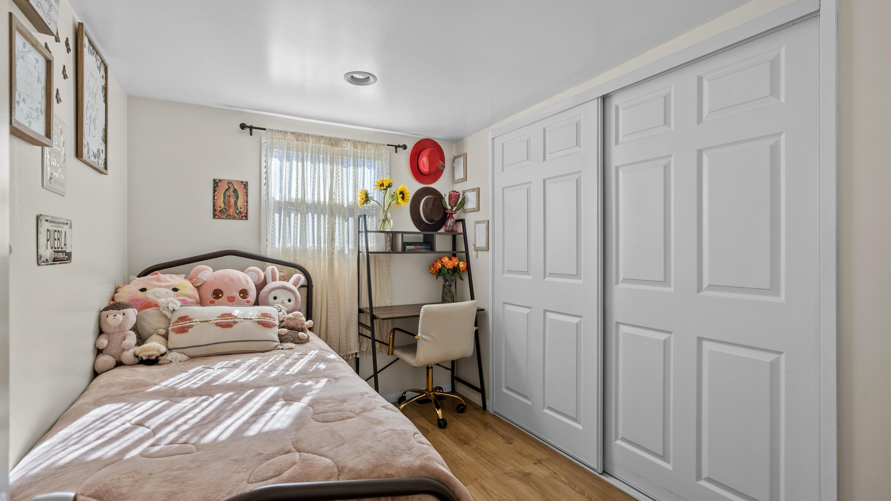18035 Soledad Canyon Road Santa Clarita, CA 91387 - Photo 15 of 20 a bedroom with a bed and a chandelier
