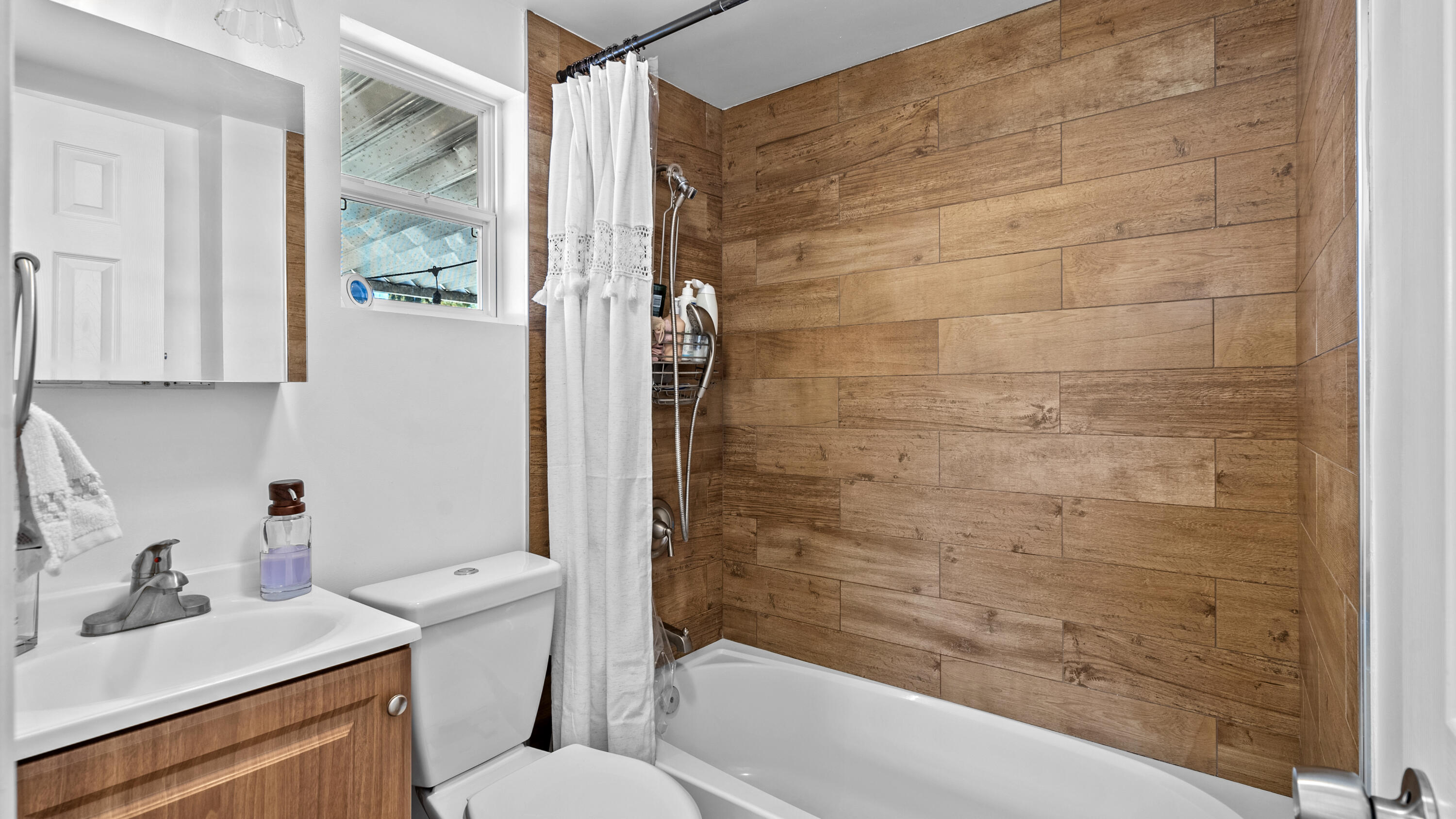18035 Soledad Canyon Road Santa Clarita, CA 91387 - Photo 17 of 20 a bathroom with a sink toilet and shower