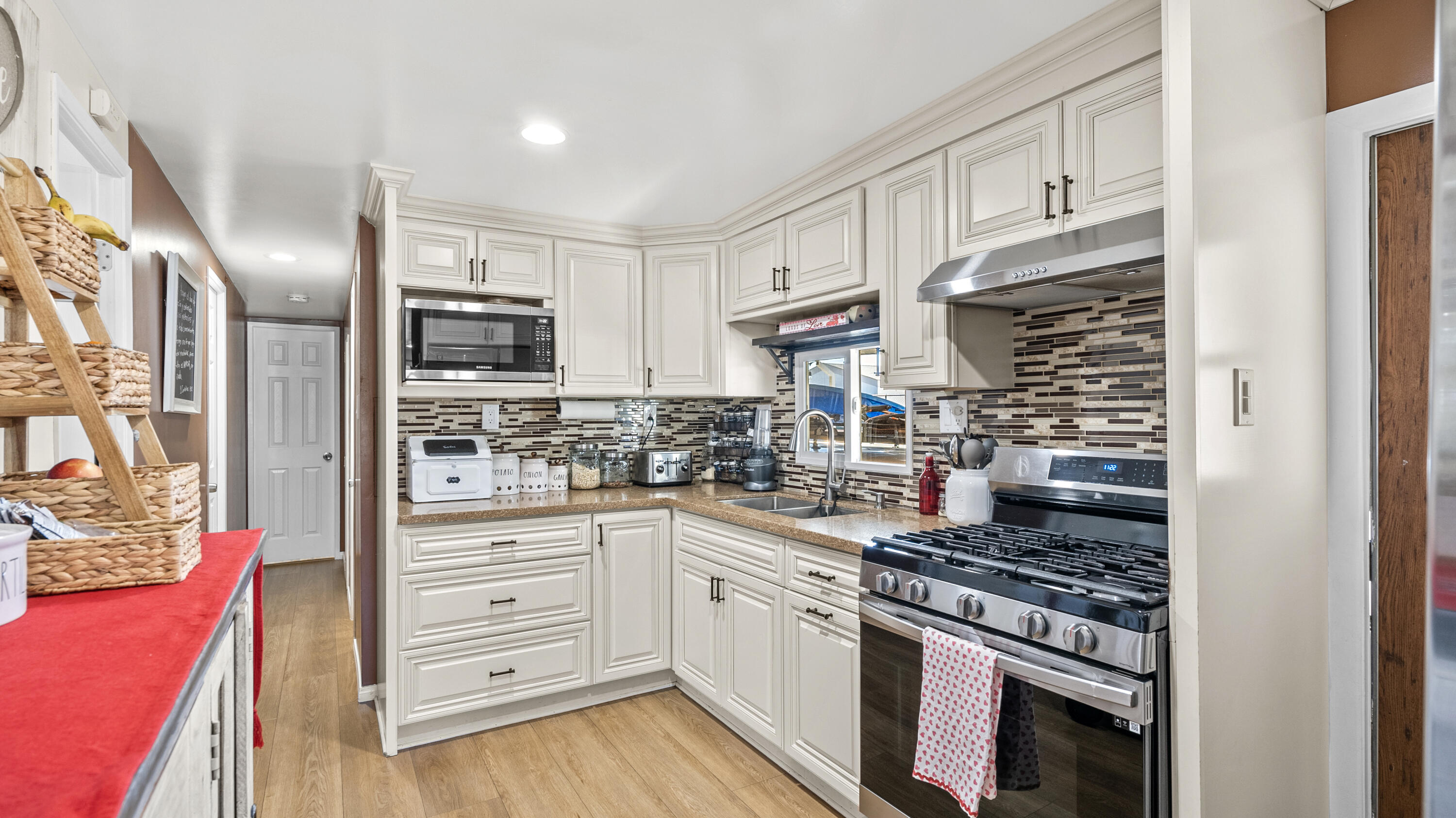 18035 Soledad Canyon Road Santa Clarita, CA 91387 - Photo 10 of 20 a kitchen with stainless steel appliances granite countertop a stove and cabinets