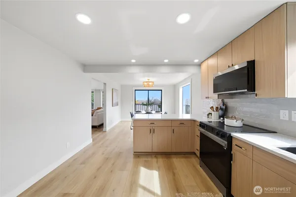 a spacious bedroom with a large bed and windows