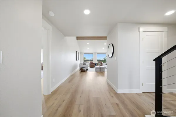 a view of a living room and a wooden floor