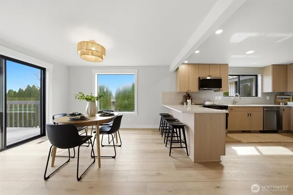 a view of a dining room with furniture window and wooden floor