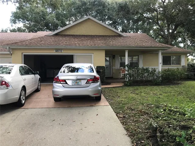a view of a car parked in front of a house