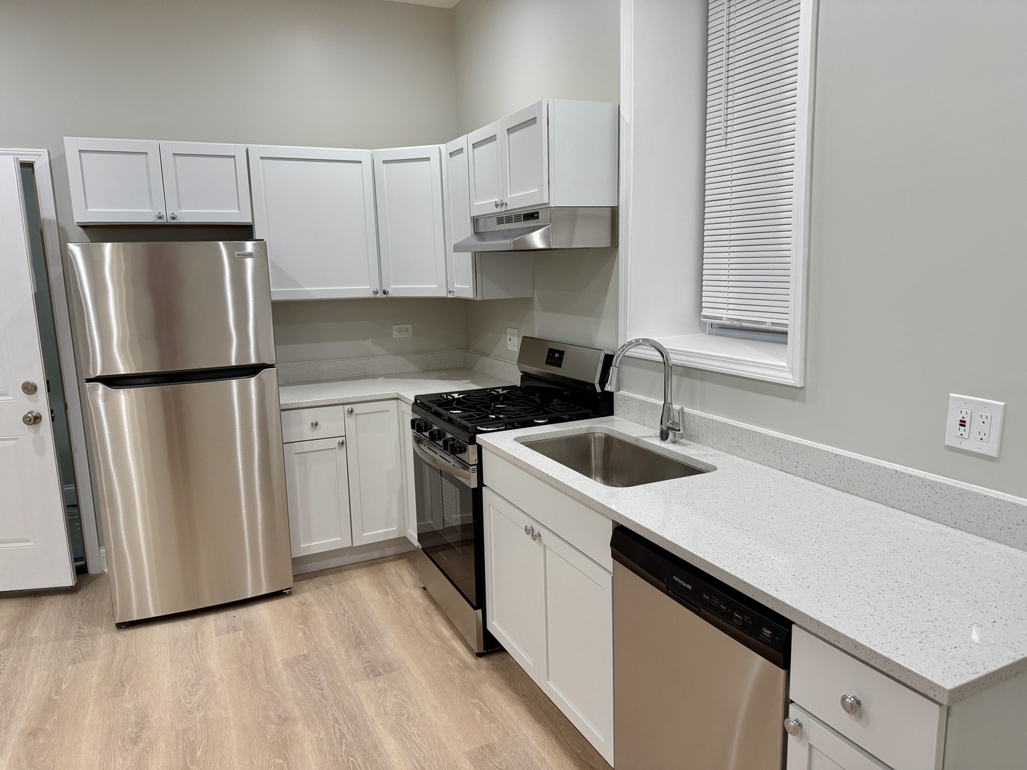 2003 South Allport Street, Unit 1 Chicago, IL 60608 - Photo 5 of 15 a kitchen with a sink a refrigerator and cabinets