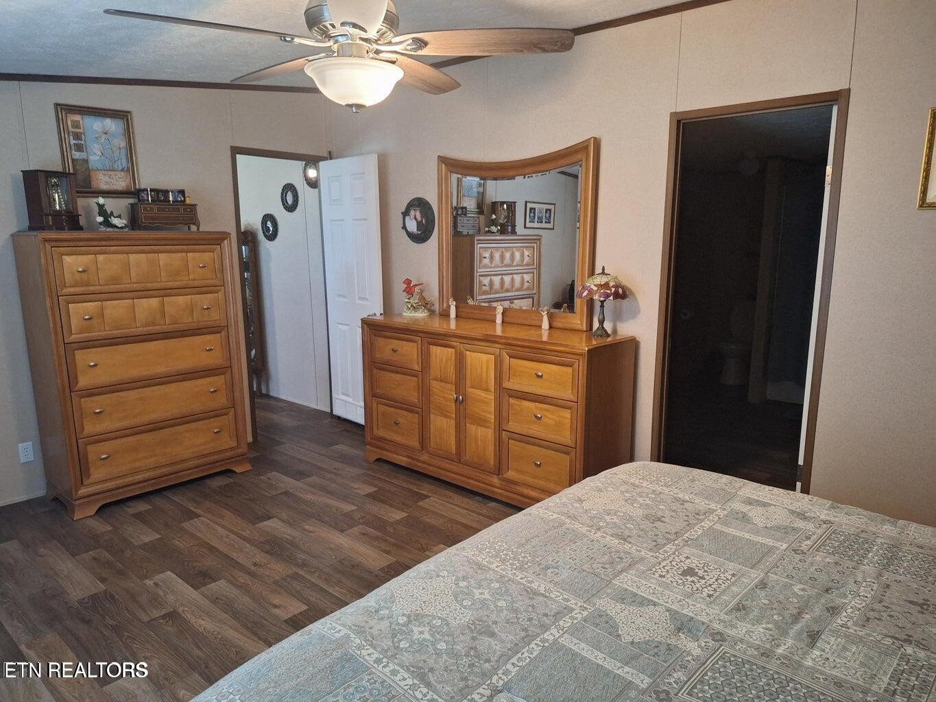 1450 Belltown Road Tellico Plains, TN 37385 - Photo 30 of 32 a bedroom with a bed and a dresser