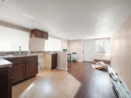a kitchen with a sink cabinets and window