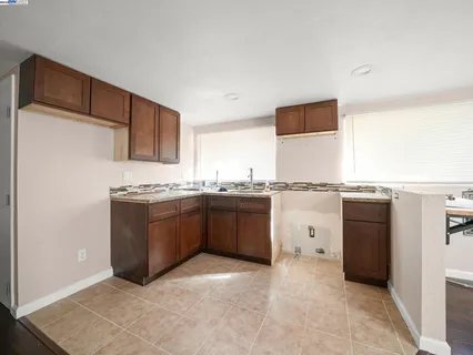 a bath tub sitting next to a white sink and a shower