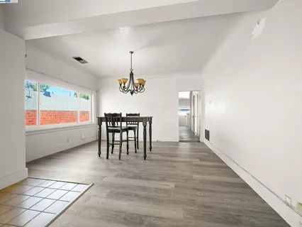 a view of a room with furniture and window