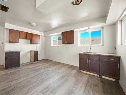 a kitchen with stainless steel appliances granite countertop a sink and cabinets