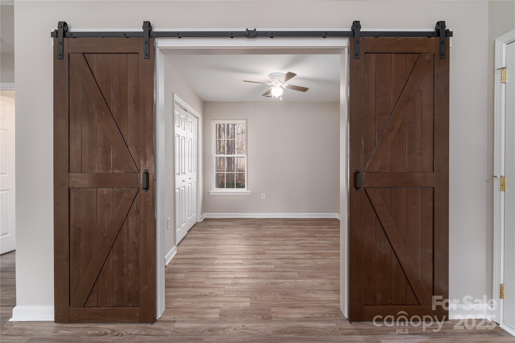 1969 Beth Haven Church Road Denver, NC 28037 - Photo 11 of 33 a view of a hallway with wooden floor and a bathroom