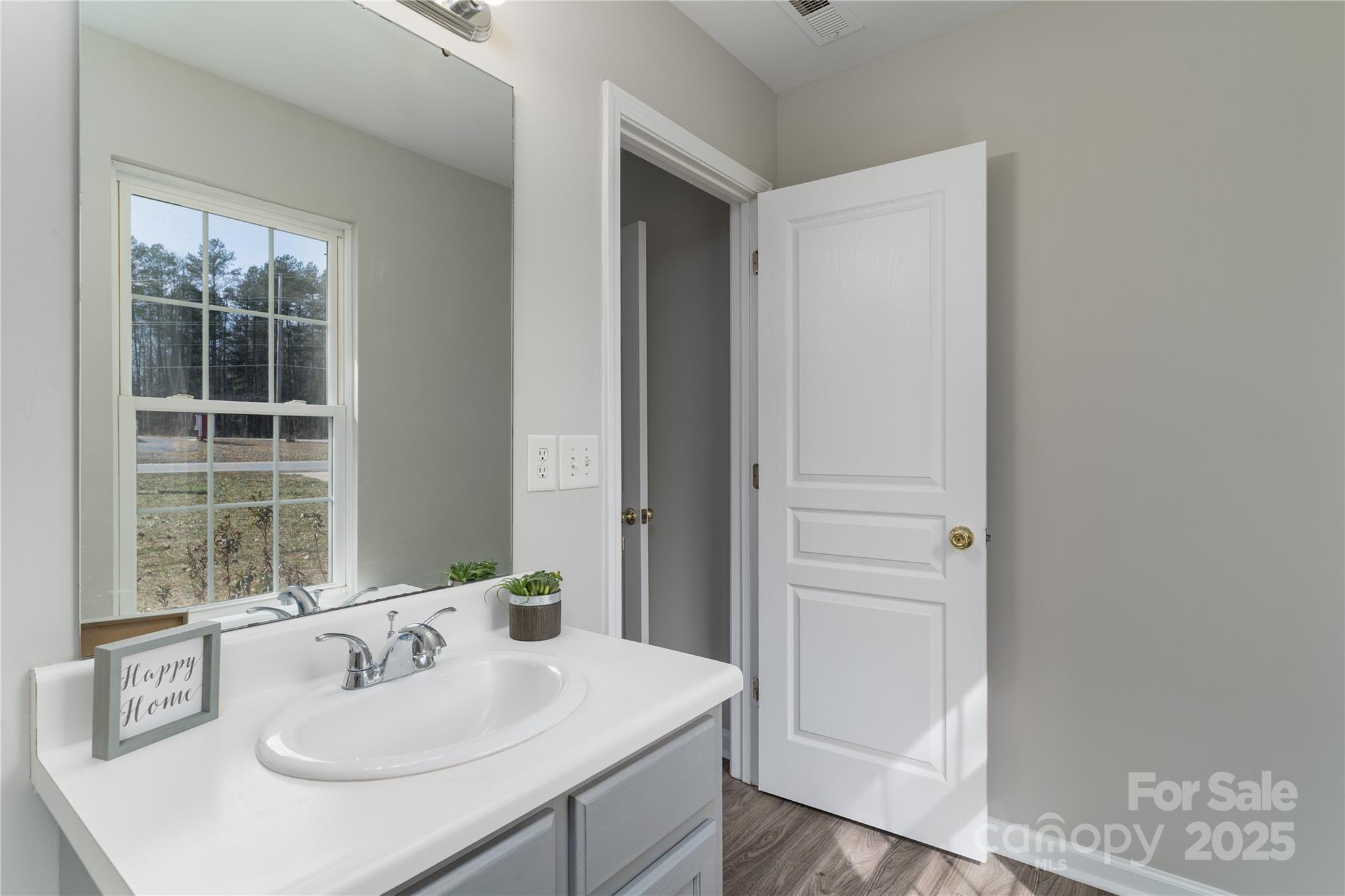 1969 Beth Haven Church Road Denver, NC 28037 - Photo 20 of 33 a bathroom with a sink vanity and a mirror