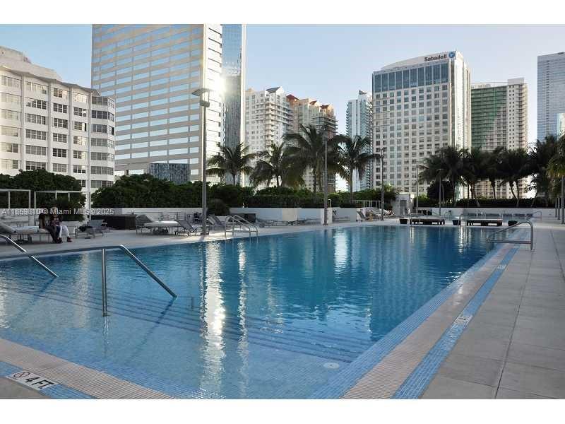 951 Brickell Avenue, Unit 3609 Miami, FL 33131 - Photo 16 of 25 a view of swimming pool with outdoor seating