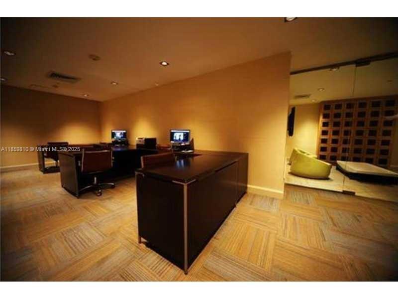 951 Brickell Avenue, Unit 3609 Miami, FL 33131 - Photo 18 of 25 a kitchen with a sink and cabinets