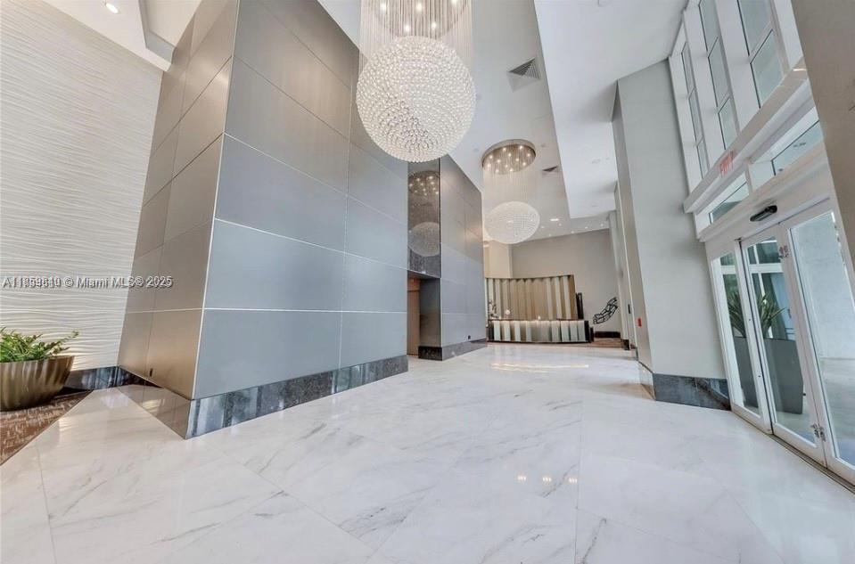 951 Brickell Avenue, Unit 3609 Miami, FL 33131 - Photo 3 of 25 a view of a hallway with seating space