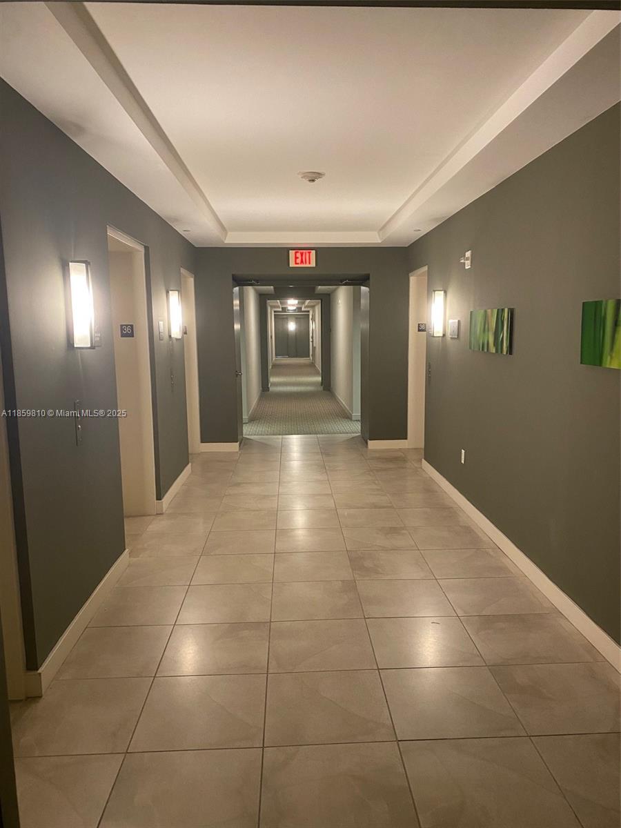 951 Brickell Avenue, Unit 3609 Miami, FL 33131 - Photo 4 of 25 a view of a hallway with chandelier