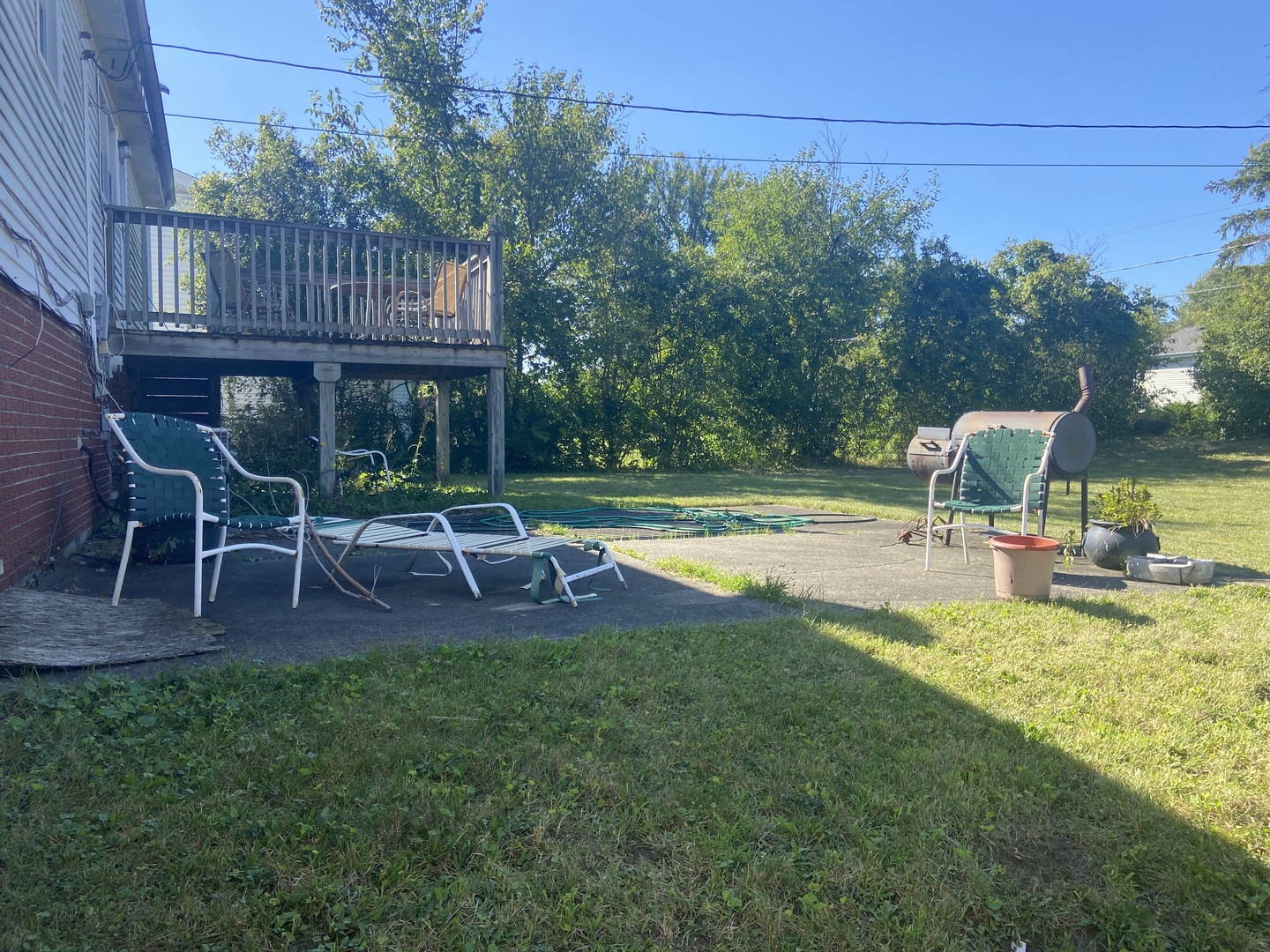 1338 Jill Terrace Homewood, IL 60430 - Photo 14 of 15 a view of a chair and table on the wooden deck