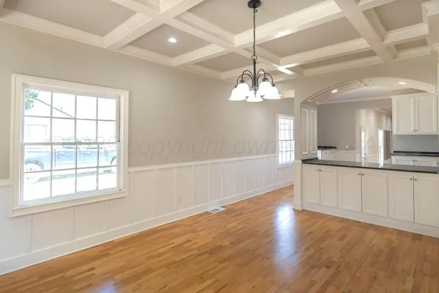 a view of a kitchen with a dishwasher cabinets and wooden floor