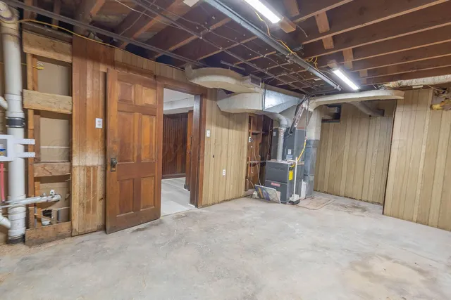 a view of an empty room with wooden walls