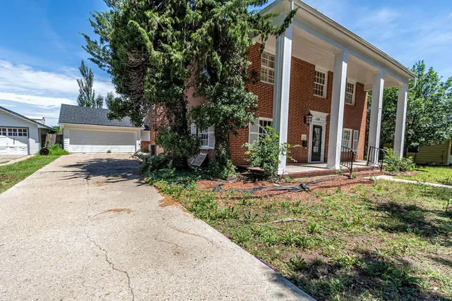 front view of a house with a small yard