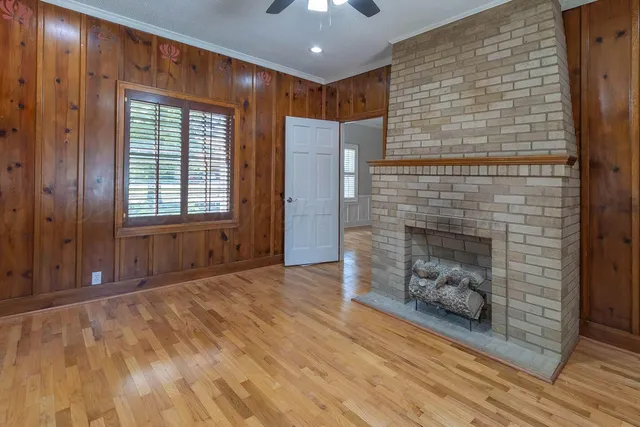 a view of an empty room and fire place