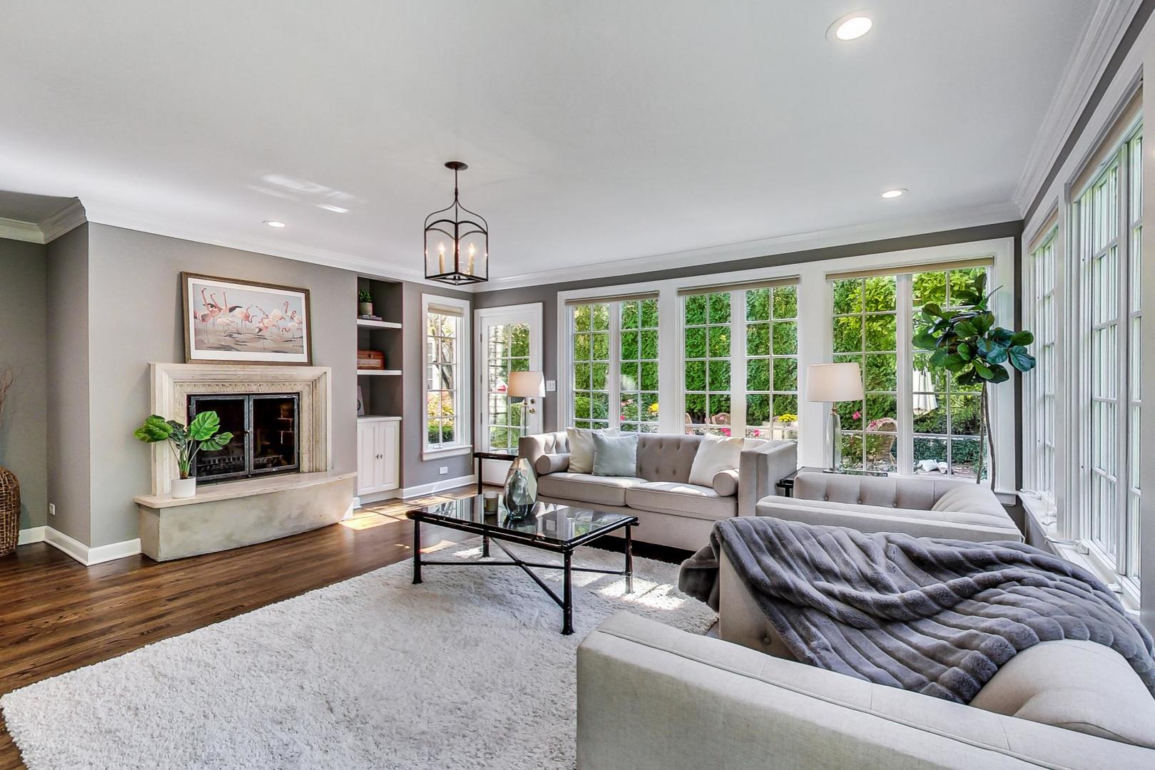 110 Sheridan Road Winnetka, IL 60093 - Photo 16 of 41 a living room with furniture and a fireplace