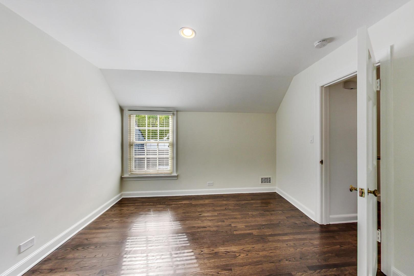 110 Sheridan Road Winnetka, IL 60093 - Photo 32 of 41 wooden floor in an empty room with a window