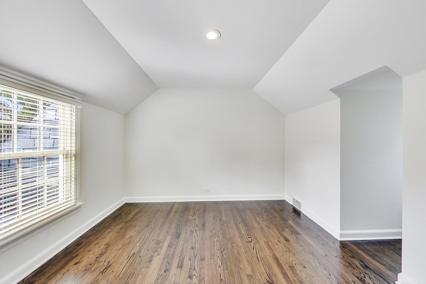 110 Sheridan Road Winnetka, IL 60093 - Photo 33 of 41 wooden floor in an empty room with a window