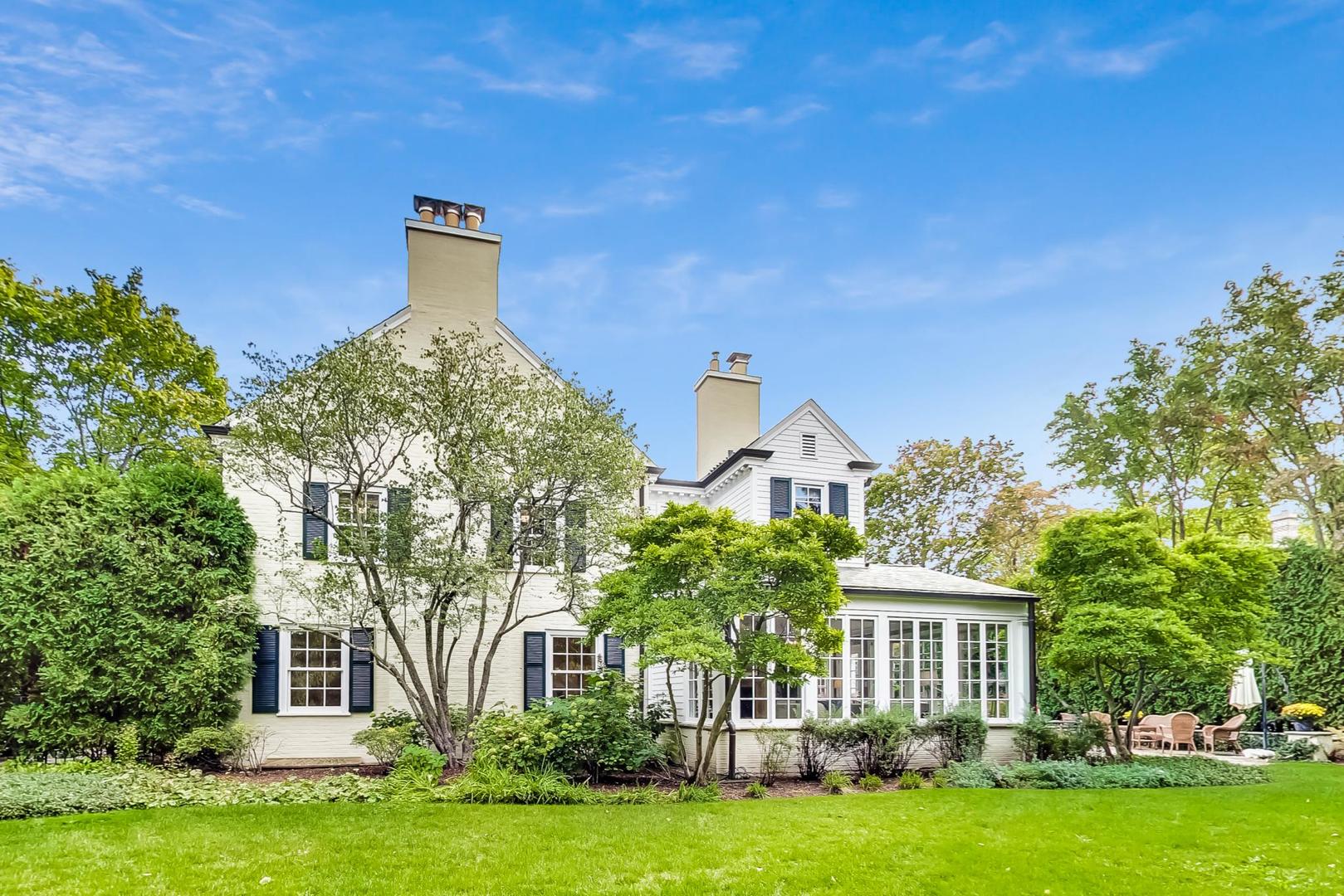 110 Sheridan Road Winnetka, IL 60093 - Photo 38 of 41 a front view of a house with a garden