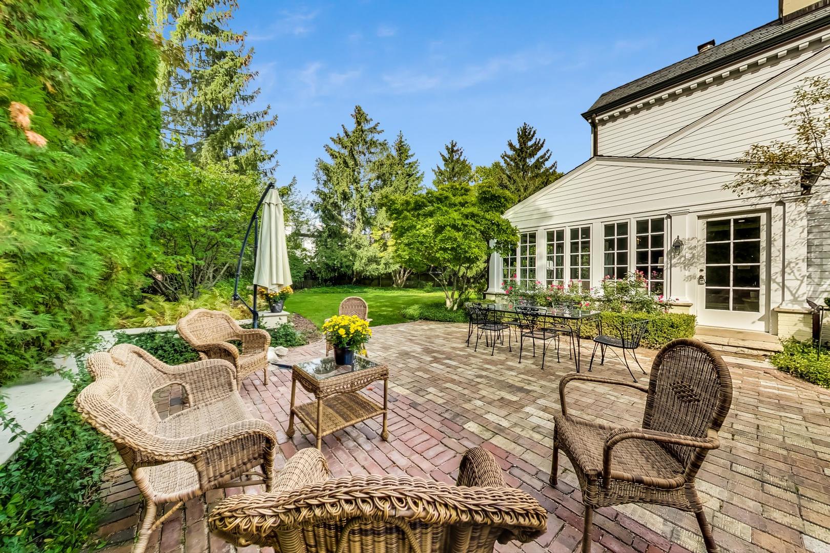 110 Sheridan Road Winnetka, IL 60093 - Photo 40 of 41 a view of a patio with table and chairs with wooden floor and fence