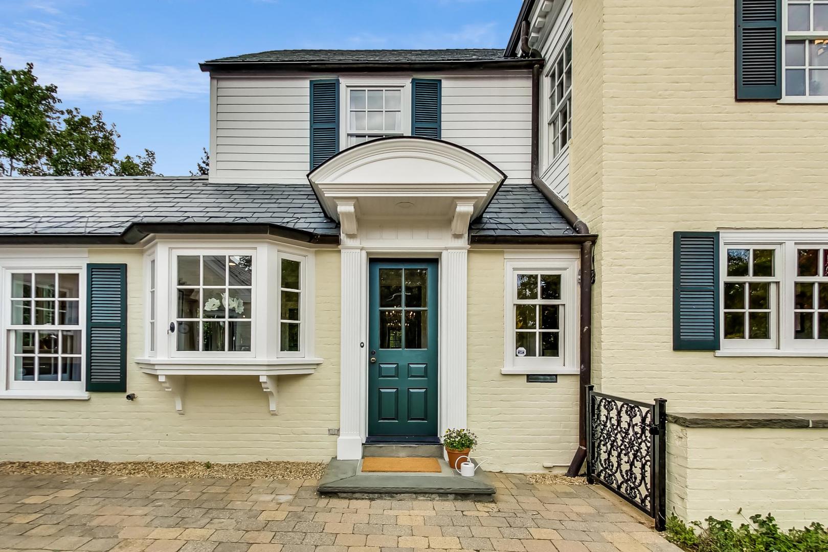 110 Sheridan Road Winnetka, IL 60093 - Photo 4 of 41 a front view of a house with glass windows