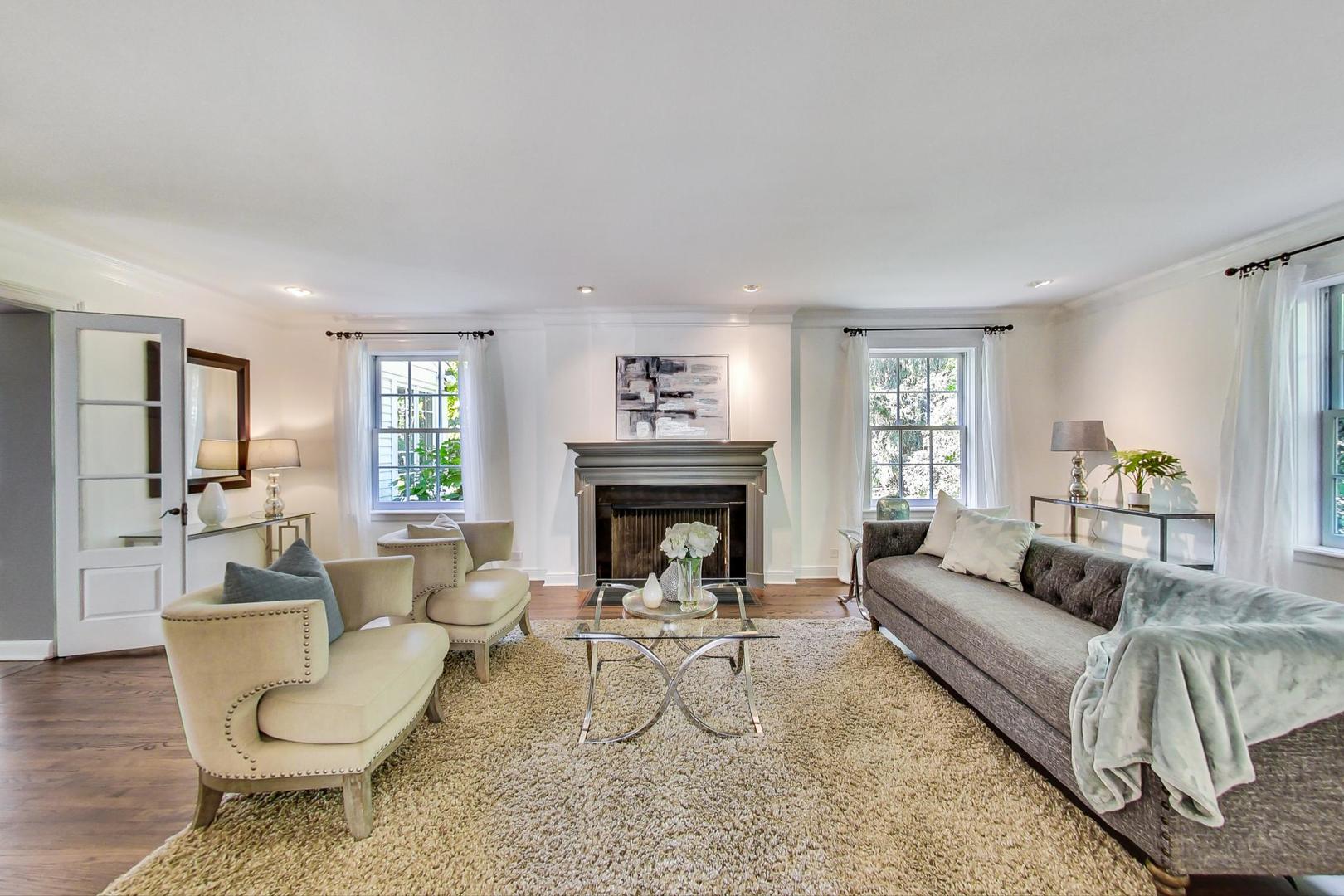 110 Sheridan Road Winnetka, IL 60093 - Photo 6 of 41 a living room with furniture and a fireplace