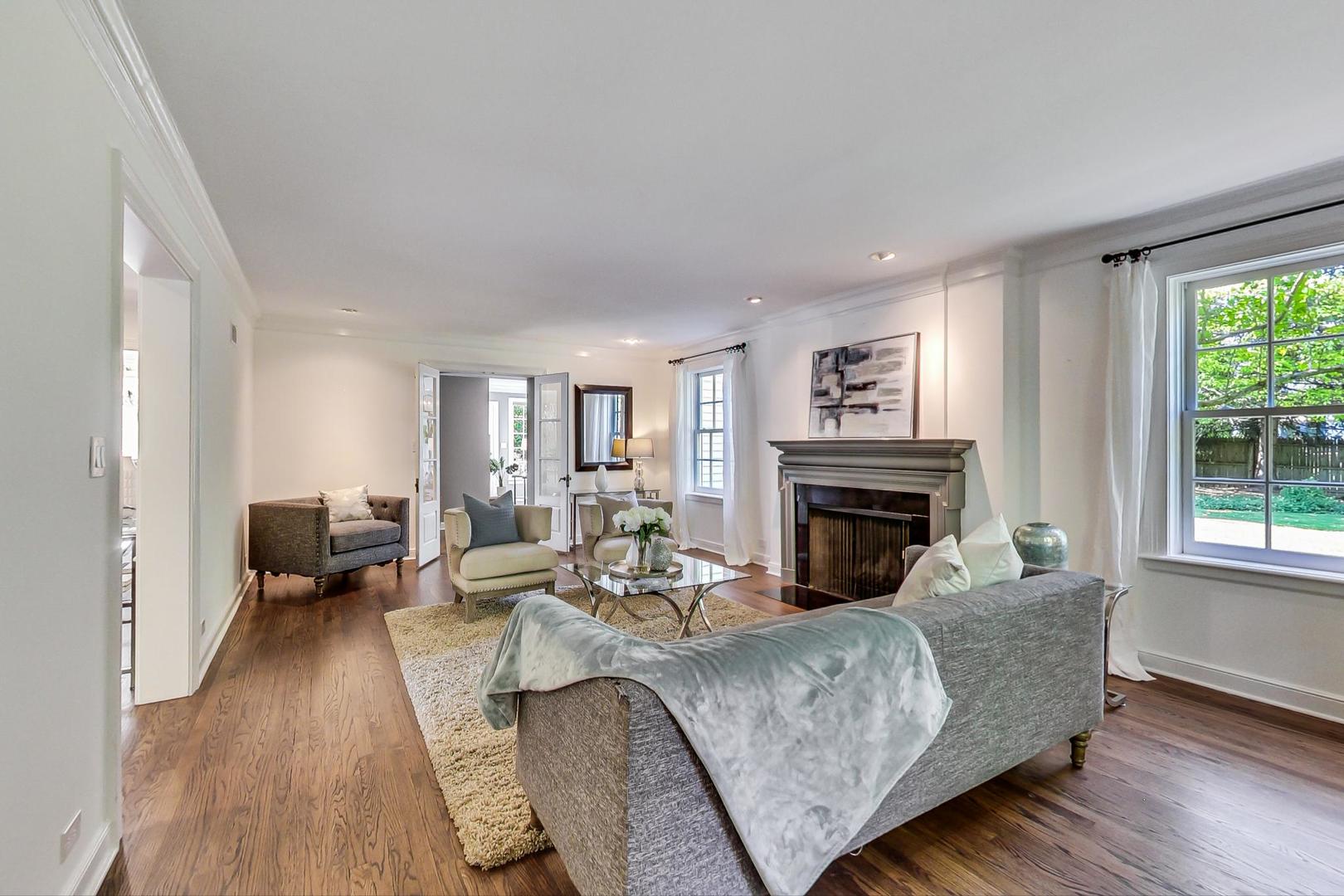 110 Sheridan Road Winnetka, IL 60093 - Photo 7 of 41 a living room with furniture and a fireplace