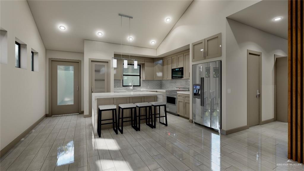 308 Love Drive Edcouch, TX 78538 - Photo 6 of 13 a kitchen with refrigerator a table and chairs