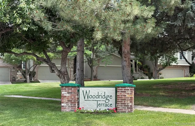 a view of a park that has a tree on the side of it