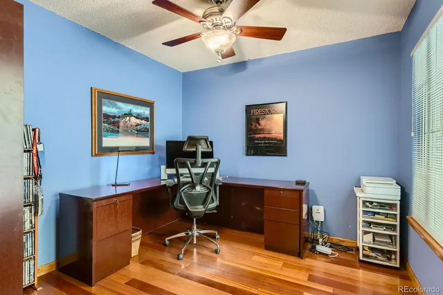 a workspace with furniture and wooden floor