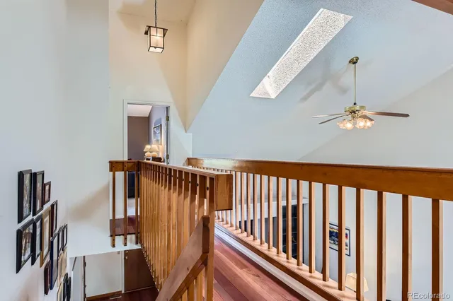 a view of staircase with wooden floor
