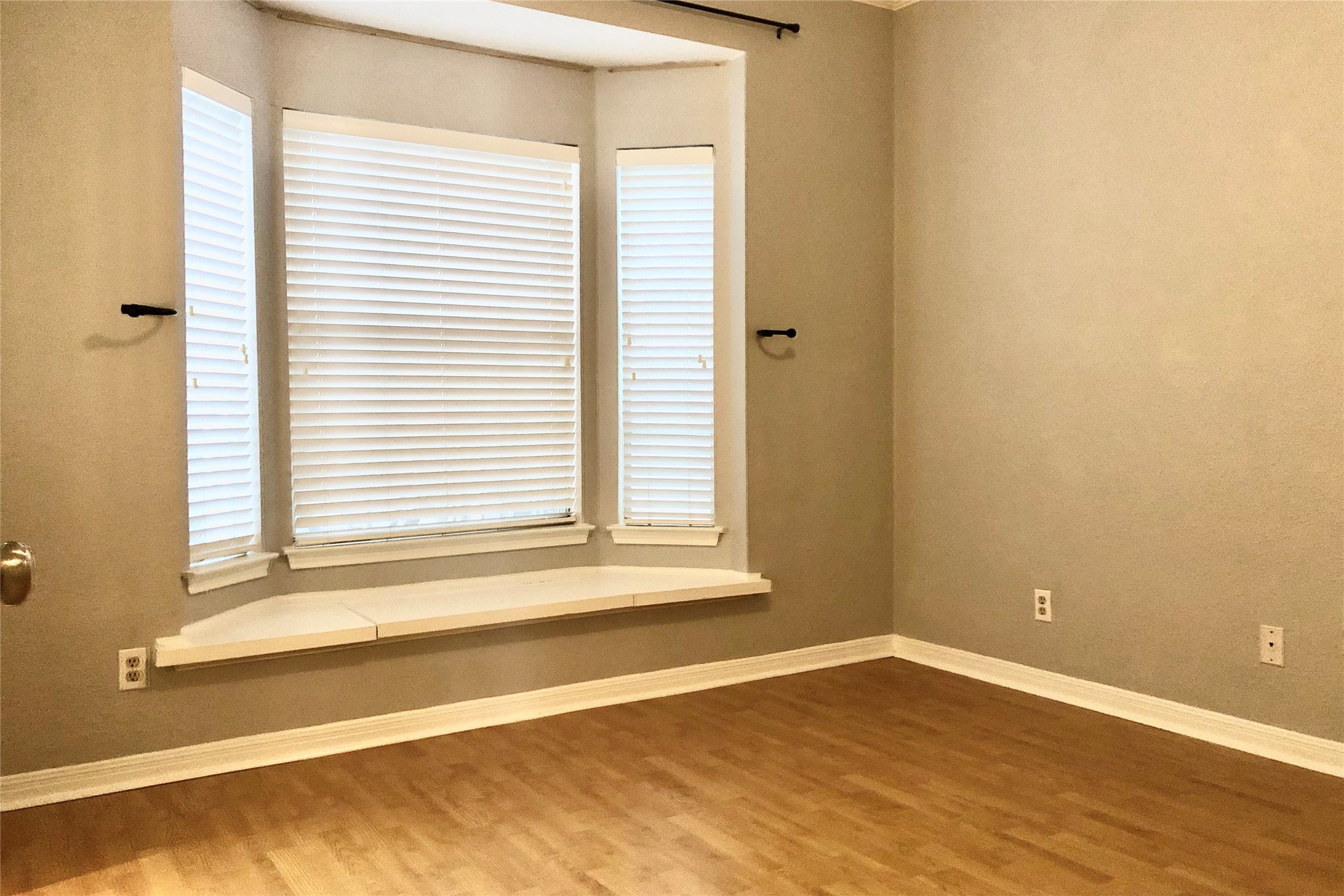 3111 Tom Green Street, Unit 204 Austin, TX 78705 - Photo 8 of 9 Spare room with baseboards and wood finished floors